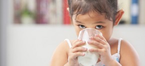 Little girl drinking milk